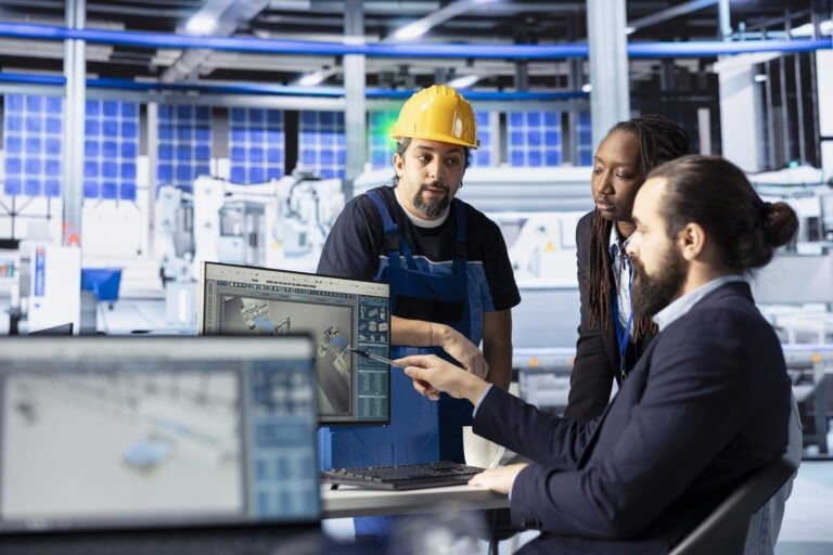 Team leader cooperating with technicians, doing system inspection